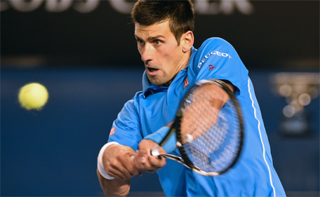 Serbia's Novak Djokovic hits a return against Britain's Andy Murray in the men's singles final on day fourteen of the 2015 Australian Open tennis tournament in Melbourne on February 1, 2015. (AFP)