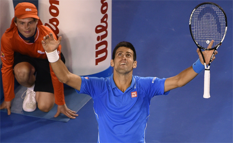 Serbia's Novak Djokovic gestures as he celebrates after victory in his men's singles final match against Britain's Andy Murray on day fourteen of the 2015 Australian Open tennis tournament in Melbourne on February 1, 2015. (AFP)