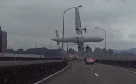 Amateur dramatic dashcam images showed the ill-fated plane hitting an elevated road as it banked steeply away from buildings before crashing into the Keeling River. (Reuters)