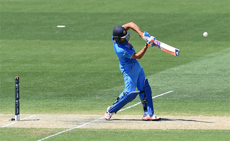 India's Rohit Sharma hits a boundary from the bowling of Afghanistan's Merwias Ashraf during the one-day international warm up cricket match between India and Afghanistan in Adelaide on February 10, 2015. (AFP)