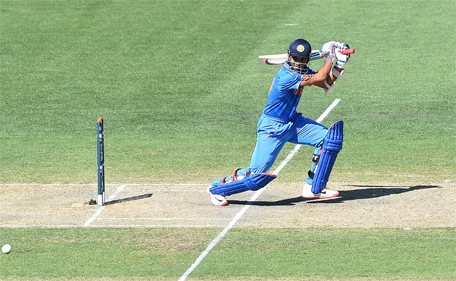 India's Ajinkya Rahane plays a shot from the bowling of Afghanistan's Dawlat Zadran during the one-day international warm up cricket match between India and Afghanistan in Adelaide on February 10, 2015. (AFP)