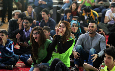 Pakistani cricket fans react as they watch the live broadcast of the Cricket World Cup match between Pakistan and India on a viewing screen in Islamabad on February 15, 2015. (AFP)