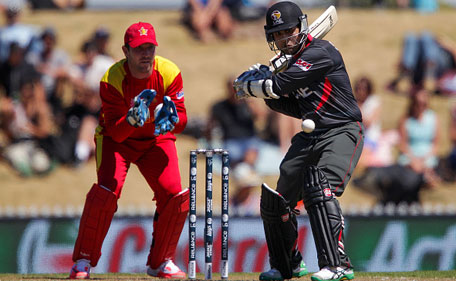 Shaiman Anwar of the United Arab Emirates bats while Brendan Taylor of Zimbabwe looks on during the 2015 ICC Cricket World Cup match between Zimbabwe and the United Arab Emirates at Saxton Field on February 19, 2015. (Getty)