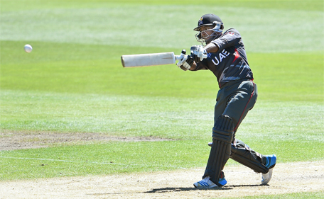 United Arab Emirates batsman Krishna Chandran hits out against the Zimbabwe bowling during the Pool B 2015 Cricket World Cup match between the UAE and Zimbabwe in Nelson on February 19, 2015. (AFP)