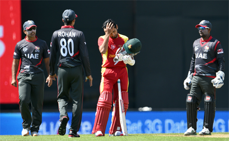 Zimbabwe batsman Sikandar Raza (centre) reacts after being struck on the helmet by a bouncer from UAE's Amjad Javed during the Pool B 2015 Cricket World Cup match between the UAE and Zimbabwe in Nelson on February 19, 2015. (AFP)