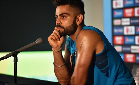 India's batsman Virat Kohli listens during a press conference at the Melbourne Cricket Ground (MCG) on February 21, 2015, ahead of their 2015 Cricket World Cup match against South Africa. (AFP)