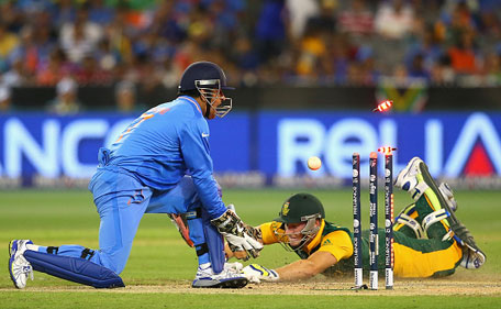 MS Dhoni of India runs out David Miller of South Africa during the 2015 ICC Cricket World Cup match between South Africa and India at Melbourne Cricket Ground on February 22, 2015 in Melbourne, Australia. (Getty)