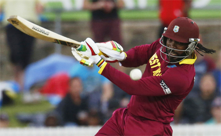 West Indies batsman Chris Gayle plays the ball to the boundary during their World Cup Cricket match against Zimbabwe in Canberra, February 24, 2015. (Reuters)