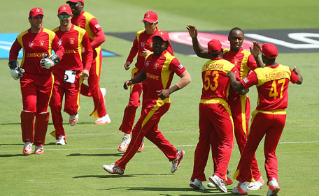 Tendai Chatara of Zimbabwe celebrates with team mates after dismissing Nasir Jamshed during the 2015 ICC Cricket World Cup match between Pakistan and Zimbabwe at The Gabba on March 1, 2015 in Brisbane, Australia. (Getty Images)