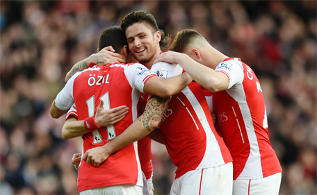 Arsenal v Everton - Barclays Premier League - Emirates Stadium - 1/3/15. Arsenal's Tomas Rosicky celebrates scoring their second goal with Olivier Giroud and Mesut Ozil. (Action Images via Reuters)