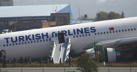 A Turkish Airlines plane lies on the field after it overshot the runway at Tribhuvan International Airport in Kathmandu March 4, 2015. (Reuters)