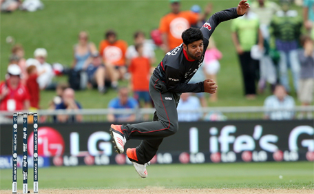 UAE cricketer Muhammad Naveed bowls during the Pool B Cricket World Cup match between the UAE and Pakistan at McLean Park in Napier on March 4, 2015. (AFP)