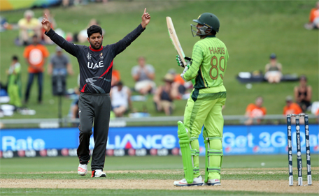 UAE bowler Muhammad Naveed (left) celebrates the wicket of Pakistan's Haris Sohail during the Pool B Cricket World Cup match between the UAE and Pakistan at McLean Park in Napier on March 4, 2015. (AFP)