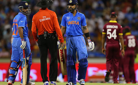 Virat Kohli of India questions umpire Kumar Dharmasena before walking after being caught by Marlon Samuels of the West Indies during the 2015 ICC Cricket World Cup match between India and the West Indies at WACA on March 6, 2015 in Perth, Australia. (Photo by Paul Kane/Getty Images)