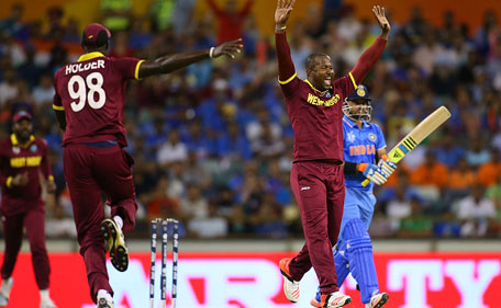 Dwayne Smith of the West Indies celebrates the wicket of Suresh Raina of India during the 2015 ICC Cricket World Cup match between India and the West Indies at WACA on March 6, 2015 in Perth, Australia. (Getty Images)