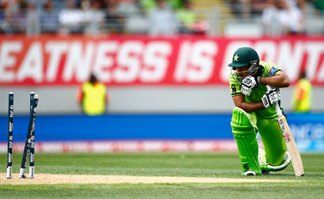 Sarfraz Ahmed of Pakistan looks dejected after being run out by Quinton de Kock of South Africa during the 2015 ICC Cricket World Cup match between South Africa and Pakistan at Eden Park on March 7, 2015 in Auckland, New Zealand. (Getty)