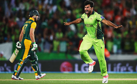 Sohail Khan (right) of Pakistan celebrates after dismissing AB de Villiers of South Africa during the 2015 ICC Cricket World Cup match between South Africa and Pakistan at Eden Park on March 7, 2015 in Auckland, New Zealand. (Getty Images)