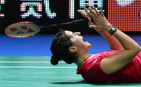 Spain's Carolina Marin reacts after winning the All England Open Badminton Championships women's singles final match in Birmingham, England, on March 8, 2015. (AFP)