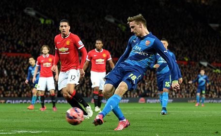 Nacho Monreal of Arsenal scores the opening goal during the FA Cup Quarter Final match between Manchester United and Arsenal at Old Trafford on March 9, 2015 in Manchester, England. (Getty Images)