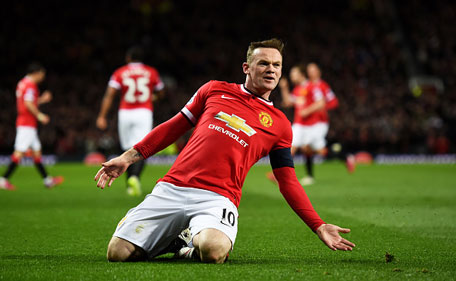 Wayne Rooney of Manchester United celebrates after scoring a goal to level the scores at 1-1 during the FA Cup Quarter Final match between Manchester United and Arsenal at Old Trafford on March 9, 2015 in Manchester, England. (Getty)