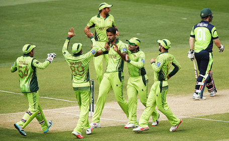 Ehsan Adil of Pakistan is congratulated by teammates after he got the wicket of Paul Stirling of Ireland during the 2015 ICC Cricket World Cup match between Pakistan and Ireland at Adelaide Oval on March 15, 2015 in Adelaide, Australia. (Getty)