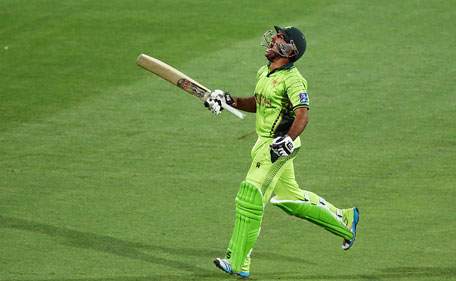 Sarfaraz Ahmed of Pakistan celebrates after reaching 100 runs during the 2015 ICC Cricket World Cup match between Pakistan and Ireland at Adelaide Oval on March 15, 2015 in Adelaide, Australia. (Getty Images)