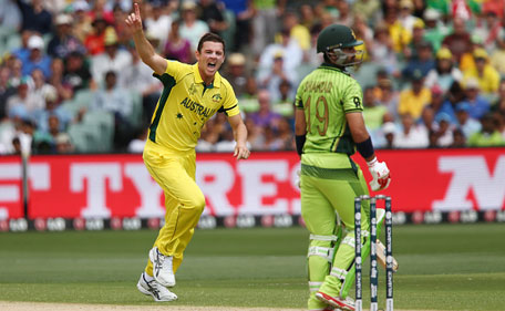 Josh Hazlewood of Australia celebrates after getting the wicket of Ahmad Shahzad of Pakistan during the 2015 ICC Cricket World Cup match between Australian and Pakistan at Adelaide Oval on March 20, 2015 in Adelaide, Australia. (Getty)