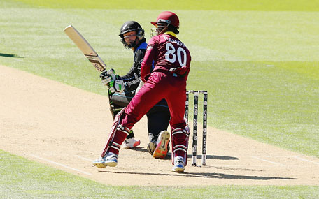 Martin Guptill of New Zealand sweeps the ball away for four runs during the 2015 ICC Cricket World Cup match between New Zealand and the West Indies at Wellington Regional Stadium on March 21, 2015 in Wellington, New Zealand. (Getty)