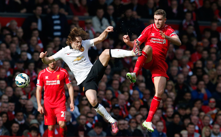 Liverpool v Manchester United - Barclays Premier League - Anfield - 2
Liverpool's Jordan Henderson in action with Manchester United's Daley Blind. (Reuters)