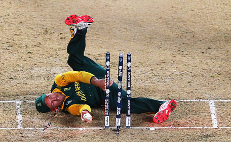 AB de Villiers of South Africa falls over the stumps during the 2015 Cricket World Cup Semi Final match between New Zealand and South Africa at Eden Park on March 24, 2015 in Auckland, New Zealand. (Getty)