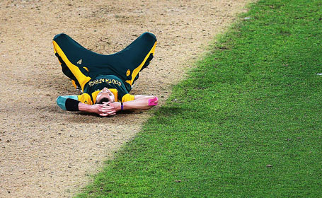 Dale Steyn of South Africa lies on the pitch after losing the 2015 Cricket World Cup Semi Final match between New Zealand and South Africa at Eden Park on March 24, 2015 in Auckland, New Zealand. (Getty Images)