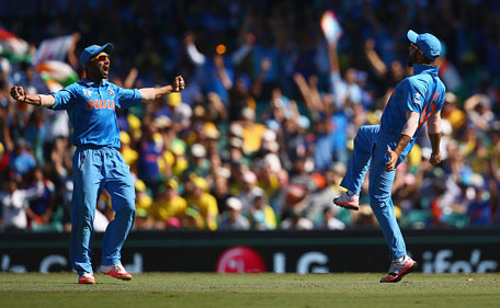 Ajinkya Rahane and Virat Kohli of India celebrate after Kohli took the catch to dismiss David Warner of Australia during the 2015 Cricket World Cup Semi Final match between Australia and India at Sydney Cricket Ground on March 26, 2015 in Sydney, Australia. (Getty)