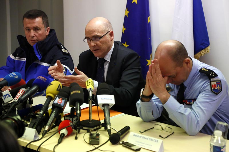 Marseille prosecutor Brice Robin, centre, with Gen. David Galtier, right,holds a press conference in Marseille, southern France, on Thursday March 26, 2015. Robin said the co-pilot was alone at the controls of the Germanwings flight that slammed into an Alpine mountainside and 'intentionally' sent the plane into the doomed descent, killing 150 people. (AP)