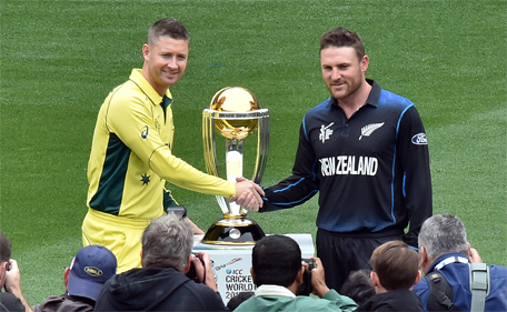 Australian captain Michael Clarke (left) and New Zealand captain Brendon McCullum shake hands during a photo session with the ICC Cricket World Cup 2015 trophy at the Melbourne Cricket Ground (MCG), ahead of the 2015 Cricket World Cup final match between Australia and New Zealand in Melbourne on March 28, 2015. (AFP)