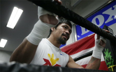 Boxer Manny Pacquiao of the Philippines, gets ready for his workout, Monday, April 13, 2015, in Los Angeles. (AP)