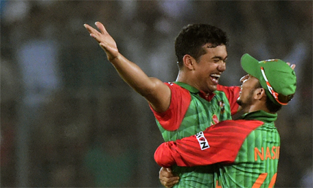 Bangladesh cricketer Taskin Ahmed (left) celebrates with teammate Nasir Hossain after the dsimissal of Pakistan cricketer Haris Sohail during the first One Day International cricket match between Bangladesh and Pakistan at the Sher-e-Bangla National Cricket Stadium in Dhaka on April 17, 2015. (AFP)