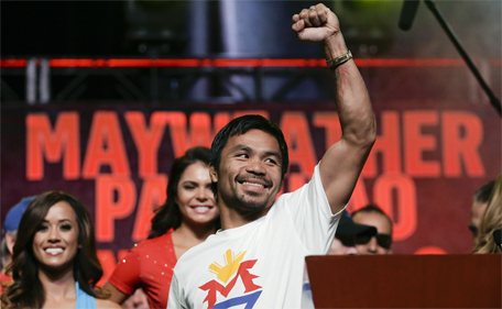 Boxer Manny Pacquiao, of the Philippines, greets fans at a rally in Las Vegas, Tuesday, April 28, 2015. (AP)