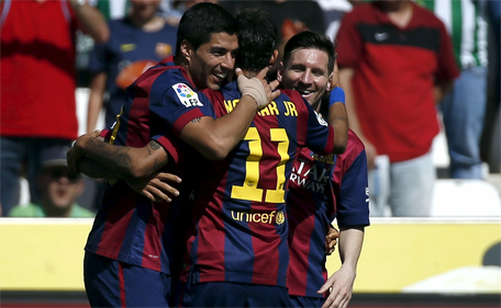 Barcelona's Luis Suarez (left) celebrates a goal with team mates Lionel Messi (right) and Neymar during their Spanish first division soccer match against Cordoba at El Arcangel stadium in Cordoba, Spain May 2, 2015. (Reuters)