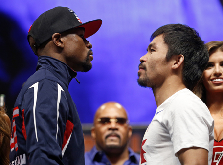 Floyd Mayweather Jr., left, and Manny Pacquiao pose during their weigh-in on Friday, May 1, 2015 in Las Vegas. The world weltherweight title fight between Mayweather Jr. and Pacquiao is scheduled for May 2. (AP)