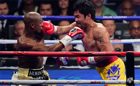 Floyd Mayweather and Manny Pacquiao box during their world welterweight championship bout at MGM Grand Garden Arena. (Joe Camporeale-USA TODAY Sports)