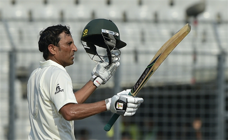 Pakistan batsman Younis Khan reacts after scoring a century during the first day of the second cricket Test match between Bangladesh and Pakistan at The Sher-e-Bangla National Cricket Stadium in Dhaka on May 6, 2015. (AFP)