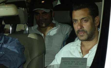 (File) Indian Bollywood actor Salman Khan (R) leaves the Sessions Court after the High Court granted him interim bail of two days in Mumbai on May 6, 2015. (AFP)