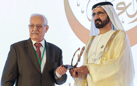 Sheikh Mohammed presenting the Mohammed bin Rashid Arabic Language Award to a winner at the Fourth International Conference on the Arabic Language in Dubai on Thursday. (Wam)