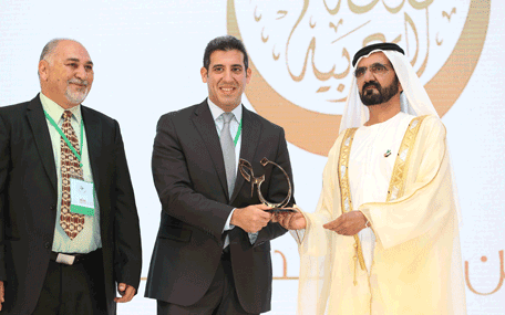 Sheikh Mohammed presenting the Mohammed bin Rashid Arabic Language Award to a winner at the Fourth International Conference on the Arabic Language in Dubai on Thursday. (Wam)