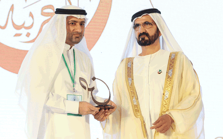Sheikh Mohammed presenting the Mohammed bin Rashid Arabic Language Award to a winner at the Fourth International Conference on the Arabic Language in Dubai on Thursday. (Wam)
