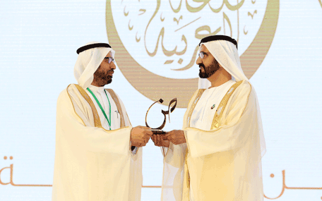 Sheikh Mohammed presenting the Mohammed bin Rashid Arabic Language Award to a winner at the Fourth International Conference on the Arabic Language in Dubai on Thursday. (Wam)