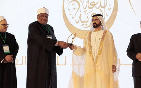 Sheikh Mohammed presenting the Mohammed bin Rashid Arabic Language Award to a winner at the Fourth International Conference on the Arabic Language in Dubai on Thursday. (Wam)