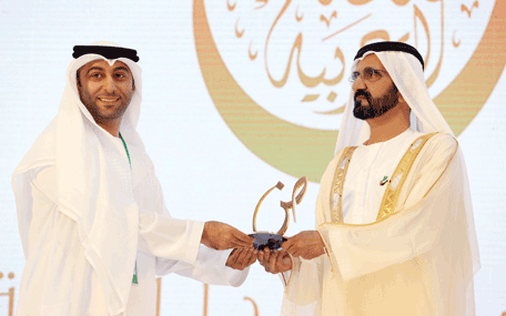 Sheikh Mohammed presenting the Mohammed bin Rashid Arabic Language Award to a winner at the Fourth International Conference on the Arabic Language in Dubai on Thursday. (Wam)