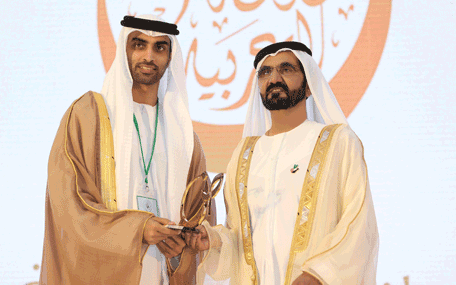 Sheikh Mohammed presenting the Mohammed bin Rashid Arabic Language Award to a winner at the Fourth International Conference on the Arabic Language in Dubai on Thursday. (Wam)