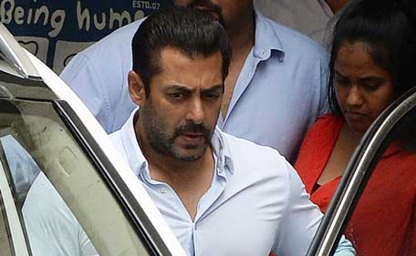 Indian Bollywood film actor Salman Khan leaves his home to appear at a Sessions Court in Mumbai on May 8, 2015. Salman Khan's five-year prison sentence for killing a homeless man with his SUV after a night out drinking 13 years ago was suspended on May 8, 2015, pending an appeal. (AFP)